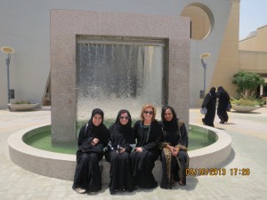 Abaya-clad Saudi leaders and Anne Doyle at Prince Mohammad University, Dhahran, Saudi Arabia